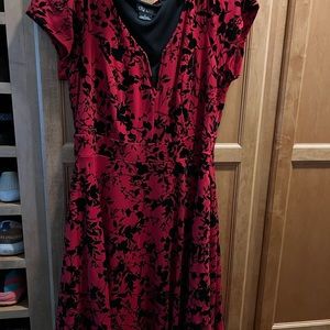 Red pin up dress. Black faux velvet raised flowers. Lots of stretch.